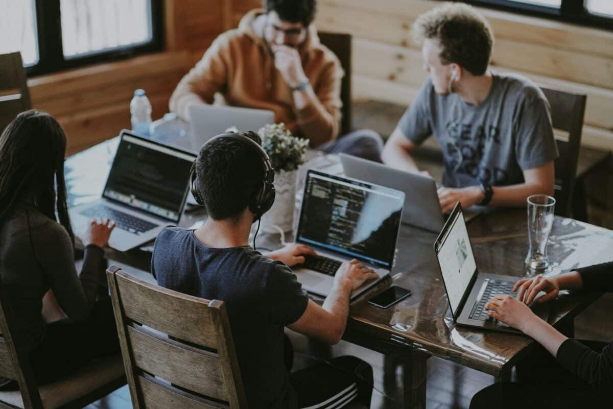 Group of people using laptop computer