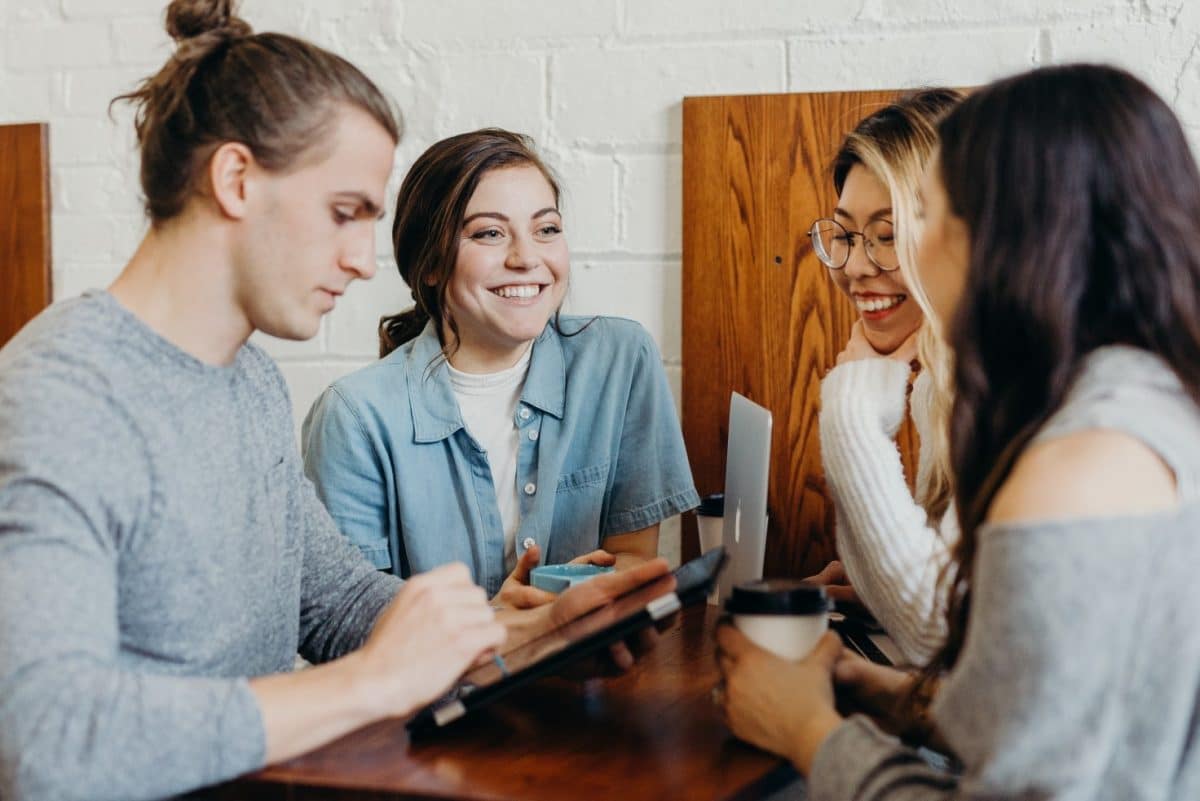 Group of students talking and smiling