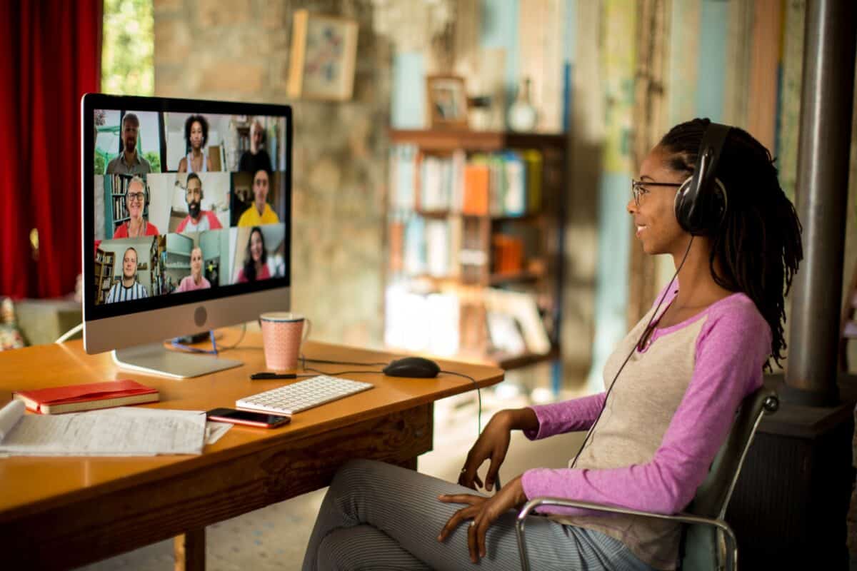 Afro-caribbean woman watching a webinar