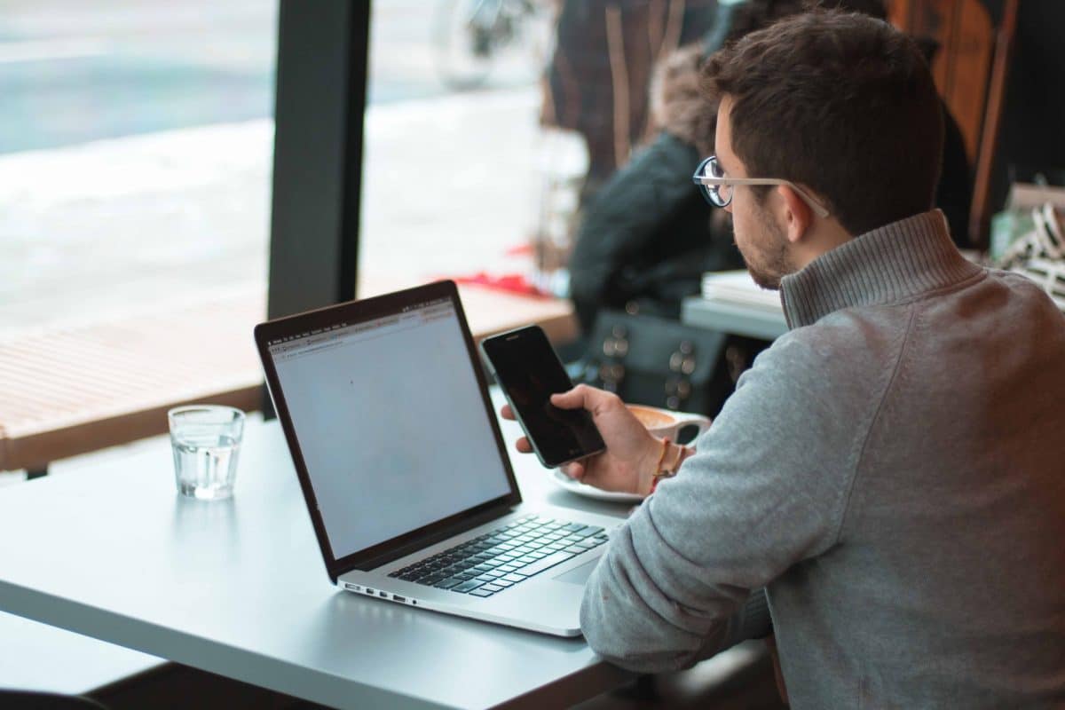 Man with laptop and mobile