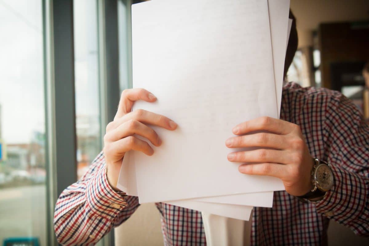 person shuffling paper